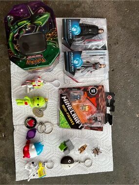 Pokemon Green and Purple Tin with Assorted Keychain Toys